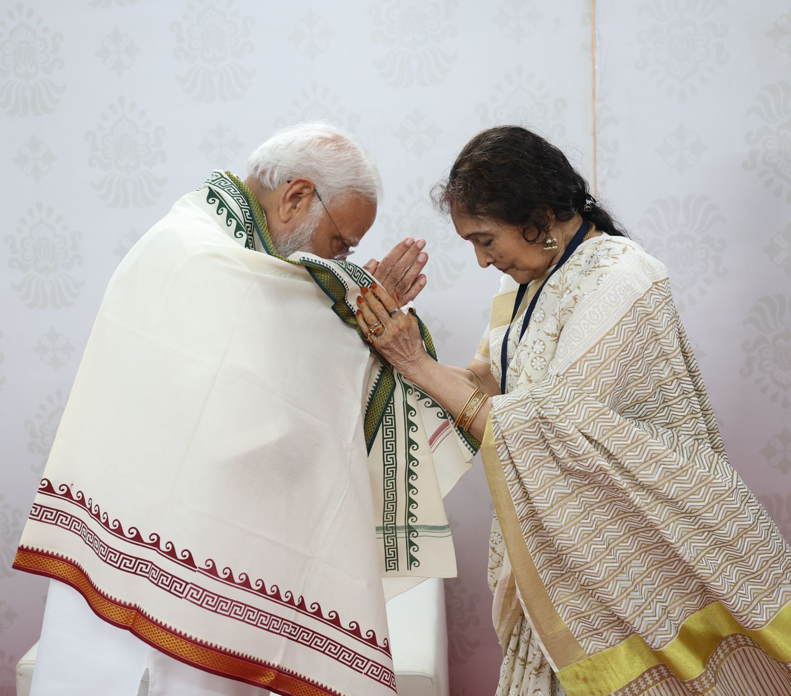 Vyjayanthimala gifts PM Modi with a shawl during their meeting in Chennai.